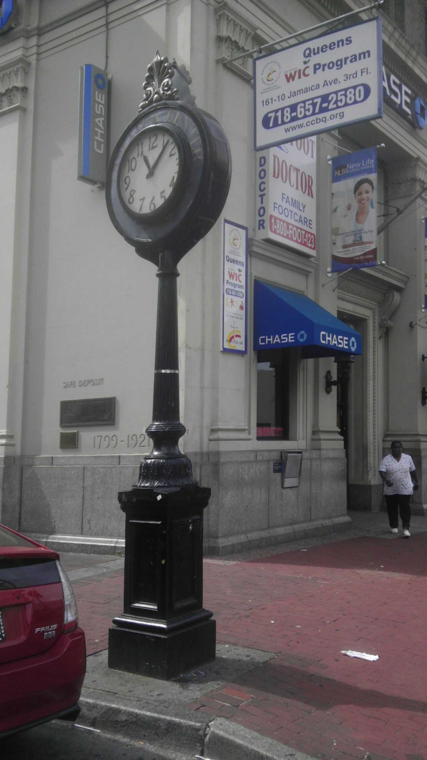 Sidewalk clock on Jamaica Avenue